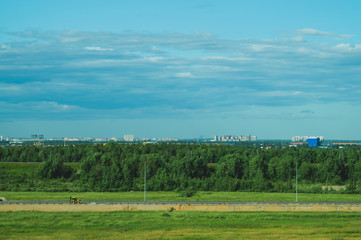Fototapeta na wymiar Urban cityscape panoramic view. horizon line with buildings. landscape with town and forest. city into a distance