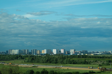 Fototapeta na wymiar Urban cityscape panoramic view. horizon line with buildings. landscape with town and forest. city into a distance