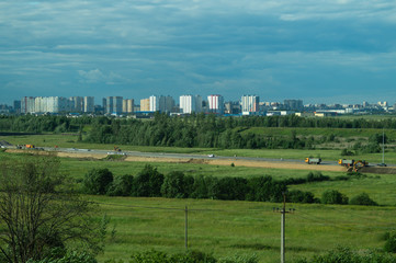 Urban cityscape panoramic view. horizon line with buildings. landscape with town and forest. city into a distance