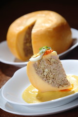 Edam cheese stuffed with beef stew with tomato sauce and hard-boiled egg.