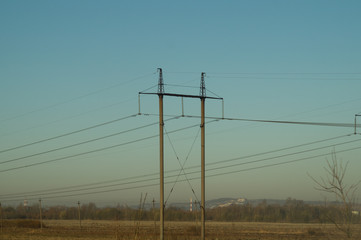 Power line posts. high voltage tower on the sky background