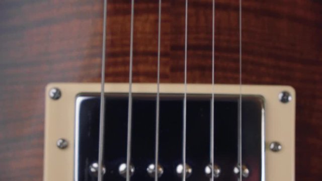 Close up of electric guitar with beautiful defocus. Strings and fretboard close-up