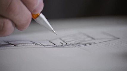 Male architect at work. Architect Hands. Pencil in hand of architect. Engineer works with drawings. Artist drawing with pencil. Close-up view - Powered by Adobe