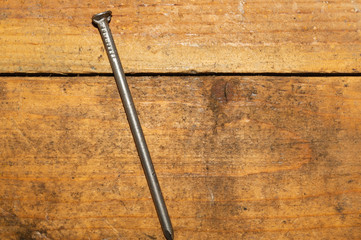 Screw on a wooden background. work tool