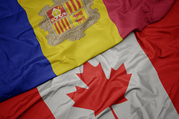 waving colorful flag of canada and national flag of andorra.