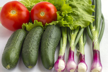 Set of fresh vegetables on a white background.