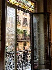 Classic tenements in Barcelona with Catalonia flags displayed.  Picture taken on a beautiful spring day