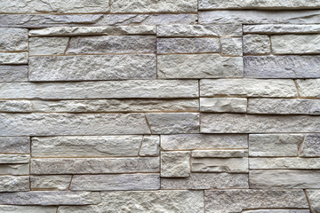 Masonry made of decorative stone. Beautiful background of flat natural stone