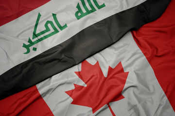 waving colorful flag of canada and national flag of iraq.
