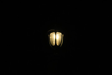 old lamp on black background