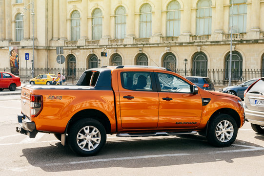 BUCHAREST, ROMANIA - APR 1, 2016: Beautiful And Powerful Orange Ford Ranger (codenamed T6) Wildtrack Parked In Center Of Bucharest. Ford Wildtrack Is A Midsize