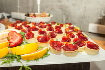 Prosciutto and rosemary with melted cheddar cheese Canape