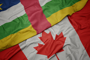 waving colorful flag of canada and national flag of central african republic.