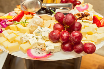 Fruit vegetarian canape at skewers catering snack with cheese