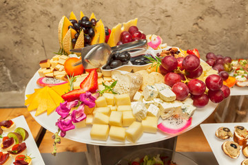 Fruit vegetarian canape at skewers catering snack with cheese