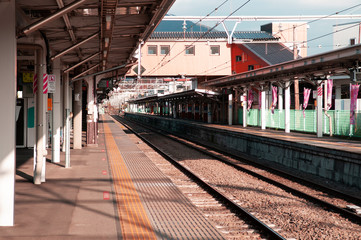 Naklejka na ściany i meble Empty Japan Otsuki train station platform under sunlight in winter