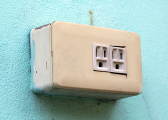 Empty electrical socket on the wall. Electricity outlet mounted at outdoor facade of house.