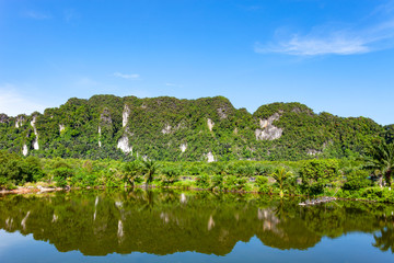 Mountain and Lake with reflex in the water scenery beautiful view with blue sky and clouds