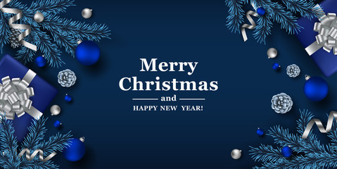 Christmas blue background with realistic fir branches, pine cones and balls. Vector top view illustration. 