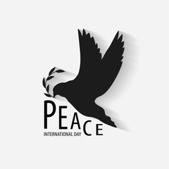 Obraz premium International Peace Day Typographic Design with dove and olive branch.