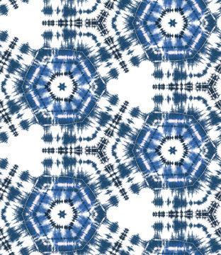 Indigo blue shibori tie dye sunburst circle background. Seamless pattern grid on white background. Japanese style batik textile. Variegated for summer fashion swatch.