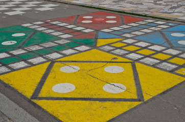 Hopscotch court with numbers from 1 to 9 drawn with paint on the asphalt