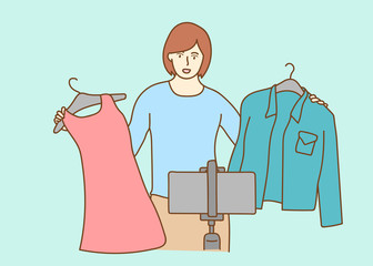 Blogger live broadcasting sell clothes viral video clip by smartphone sharing on social media