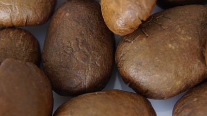 roasted coffee grains on a white background