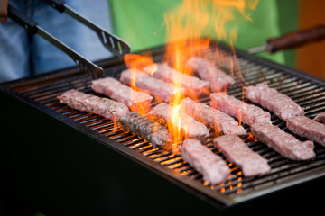 Delicious assorted grilled meat with vegetables over the coals on barbecue