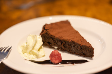 Brownie on the white plate. Food background.