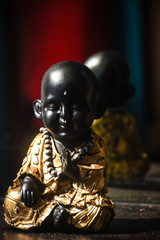 a sun shine on statue of a Gautama Buddha 
