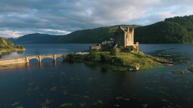 Famous Eilean Donan Castle in Scotland aerial shot from drone