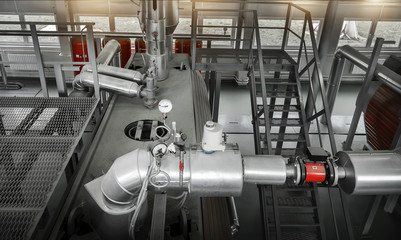 Control system for gas boiler. Boiler room with gas boilers and pipes for supplying gas and steam.  View from above