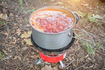 Cooking soup on a camping trip