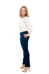 Portrait of a cheerful young woman in jeans isolated over a white background