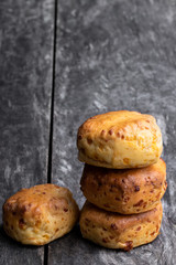 Homemade cheese scones on wooden table