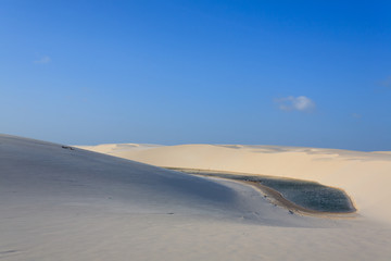 Fototapeta na wymiar White sand dunes panorama from Lencois Maranhenses National Park, Brazil.