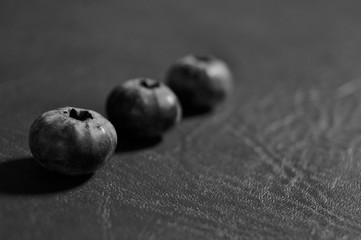 Juicy and fresh Blueberries close up isolated on dark background.  Autumn wildberry. Blueberry background. Organic Bilberry closeup. Antioxidant. Concept for healthy eating and nutrition 