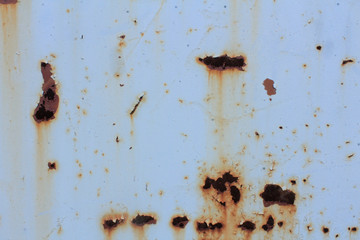 Rust stains on a gray painted iron surface
