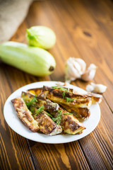 oven-baked zucchini in batter with garlic and herbs