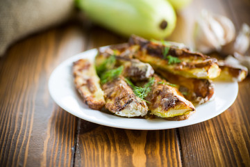 oven-baked zucchini in batter with garlic and herbs