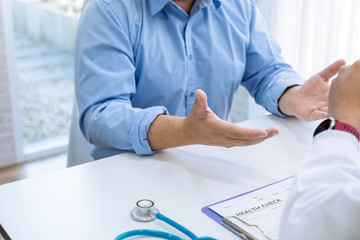 Doctor gave advice and talked to the male patient at work.