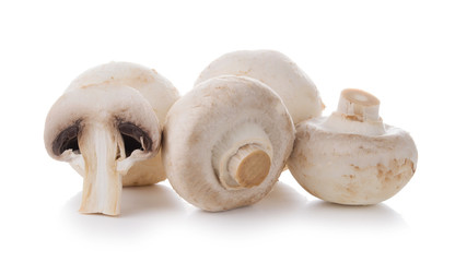 Group of champignon mushrooms isolated on a white background