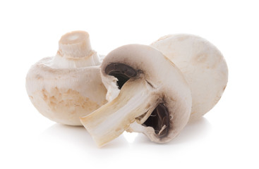 Fototapeta na wymiar mashrooms whole and sliced champignons isolated on white background