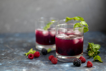 glass of strawberry juice with fresh berries