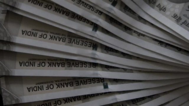 hands with new indian 500 rupees banknotes