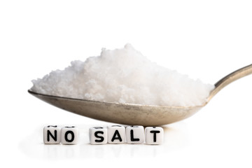 Spoon full of sea salt. No salt concept