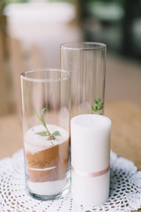 modern wedding table decoration, sand in glass vase, succulent, white pillar candle, lace