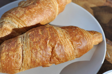 tasty croissants on a plate