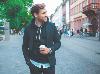 Young Adult Handsome Attractive Stylish Businessman Take a Break and Drink Coffee on the Street